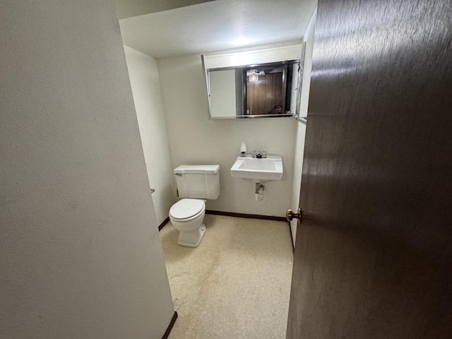 bathroom with sink and toilet