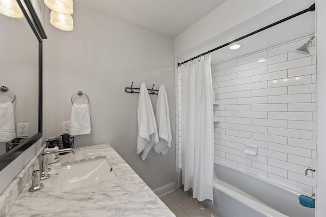 bathroom with shower / tub combo with curtain and vanity