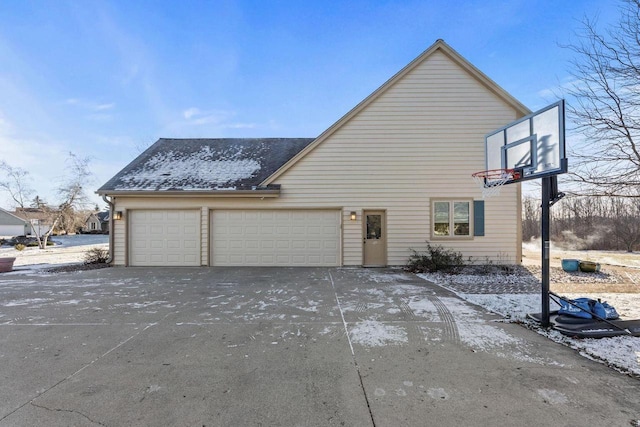 view of side of property with a garage