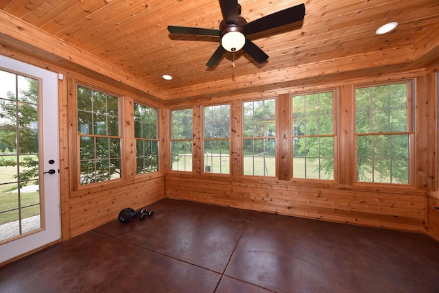 unfurnished sunroom featuring wooden ceiling and a ceiling fan