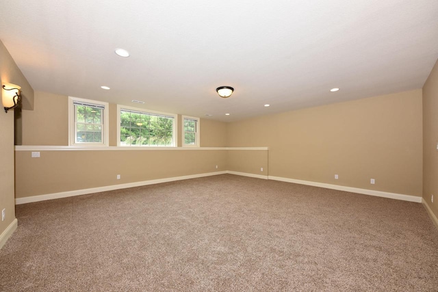 carpeted spare room with recessed lighting and baseboards