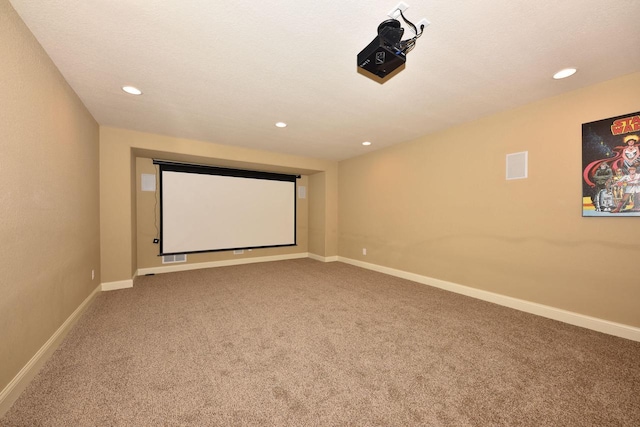 carpeted cinema featuring baseboards, a textured ceiling, and recessed lighting