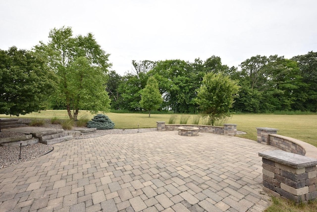 view of patio with an outdoor fire pit