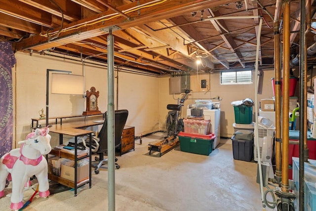 basement featuring washing machine and clothes dryer