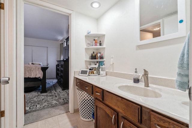 bathroom with tile patterned flooring and vanity