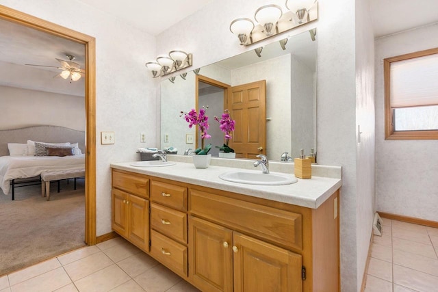 bathroom with tile patterned floors, ceiling fan, and vanity