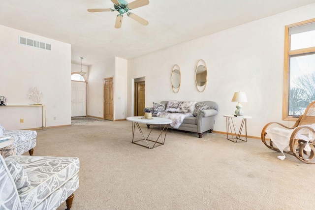 living room featuring light carpet and ceiling fan