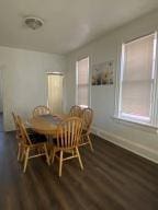 dining room with dark hardwood / wood-style floors