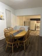 dining space with hardwood / wood-style flooring