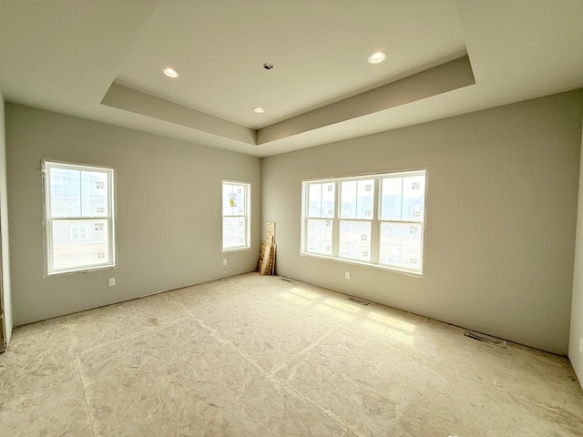 L146 Winn Dr, Waunakee, WI 53597 - carpeted empty room with a tray ceiling, recessed lighting, and visible vents