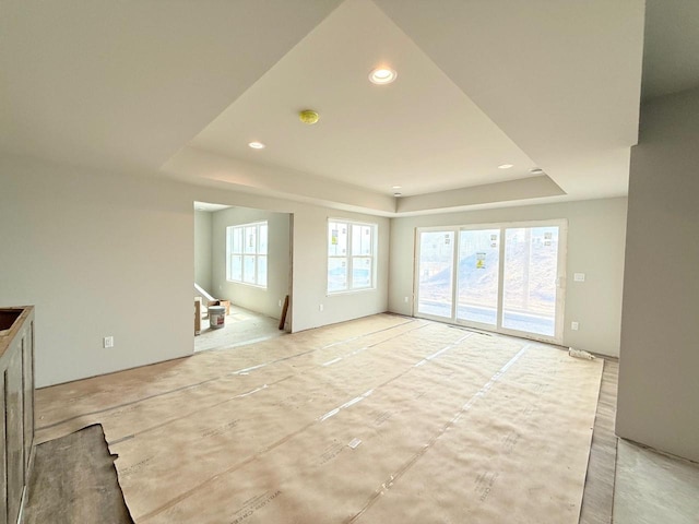 L146 Winn Dr, Waunakee, WI 53597 - unfurnished living room featuring recessed lighting and a tray ceiling