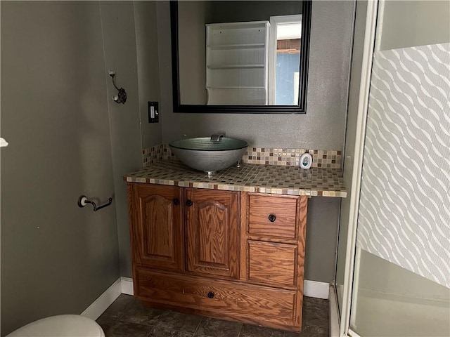 bathroom with tile patterned floors, toilet, and vanity