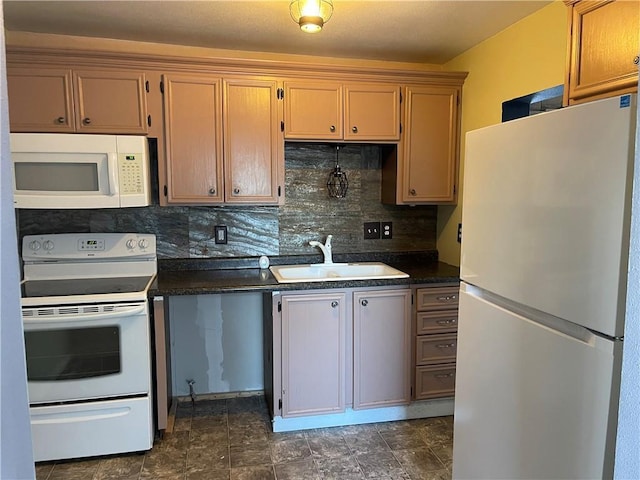 kitchen with sink, white appliances, and tasteful backsplash