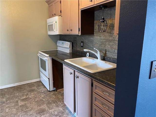 kitchen featuring sink, white appliances, hanging light fixtures, and backsplash