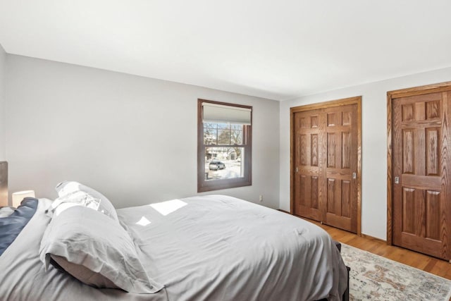 bedroom featuring light hardwood / wood-style flooring and a closet