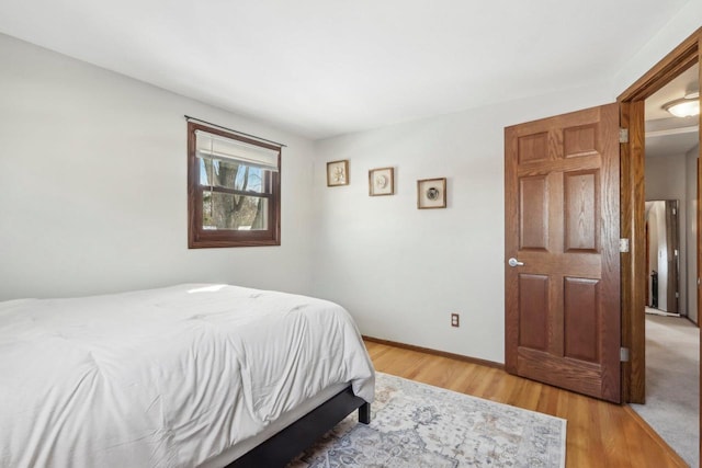 bedroom featuring wood-type flooring