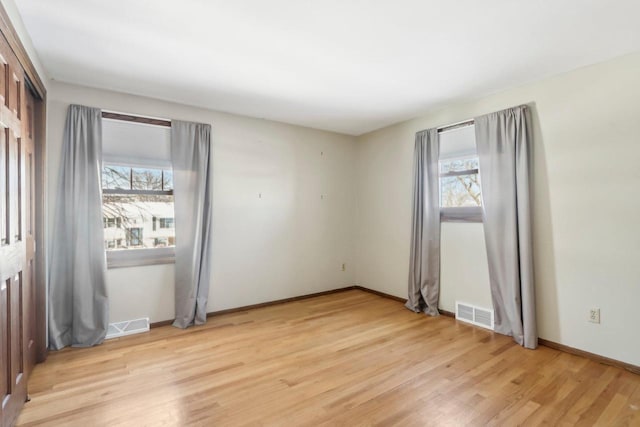 unfurnished room featuring light hardwood / wood-style flooring