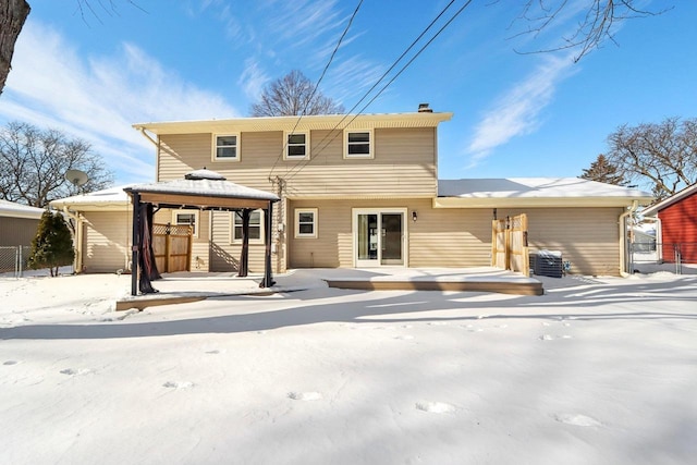 snow covered house featuring a gazebo