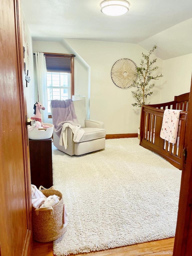 bedroom featuring carpet floors and lofted ceiling