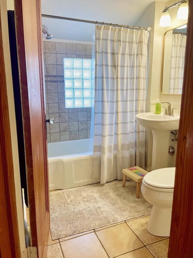 full bathroom with sink, toilet, shower / bath combination with curtain, and tile patterned flooring