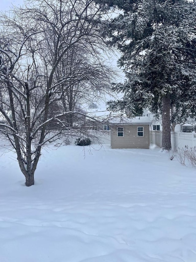 view of yard layered in snow