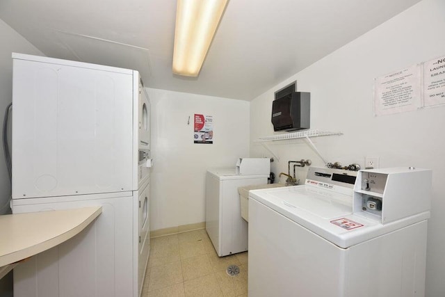 washroom featuring separate washer and dryer and stacked washer and clothes dryer