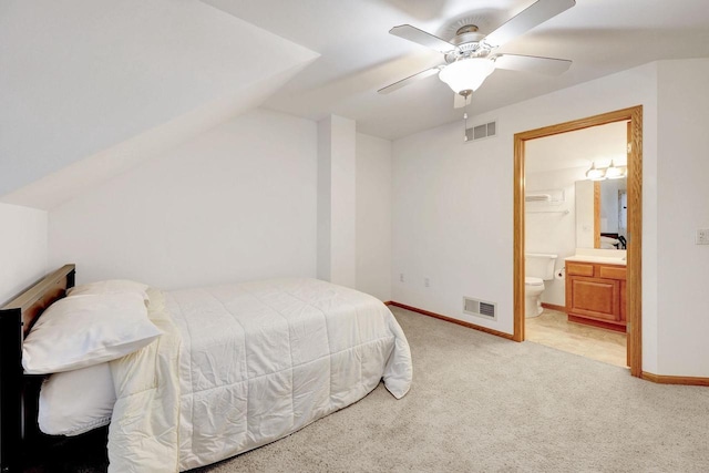 bedroom featuring visible vents, light carpet, and baseboards