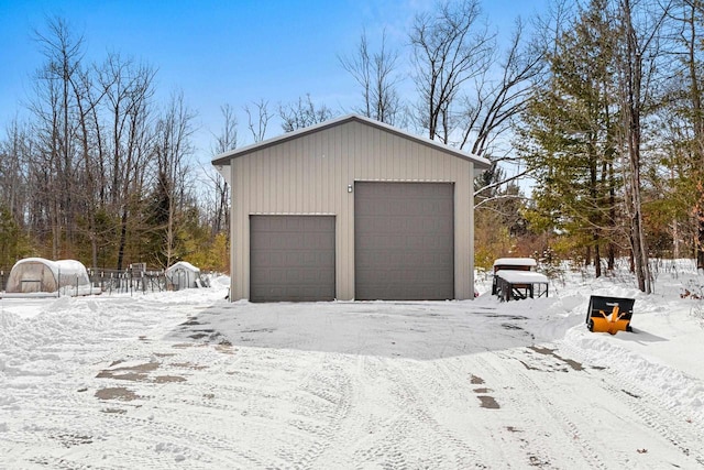 view of snow covered garage