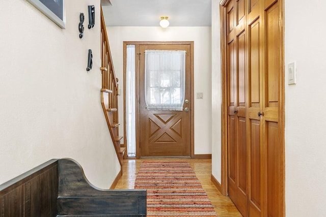 entryway with light hardwood / wood-style flooring