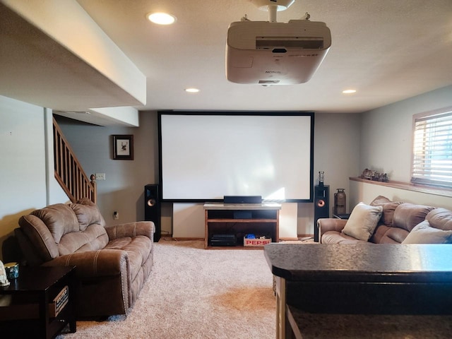 cinema featuring light colored carpet