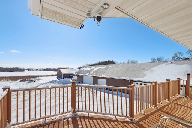 view of snow covered deck