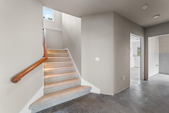 stairs with concrete floors