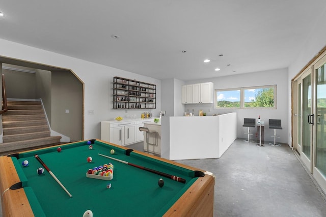 playroom featuring concrete flooring and billiards