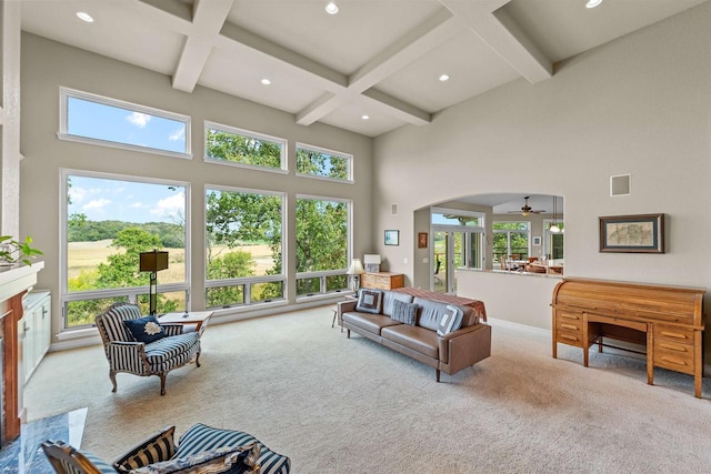 living room with beamed ceiling, light carpet, and coffered ceiling