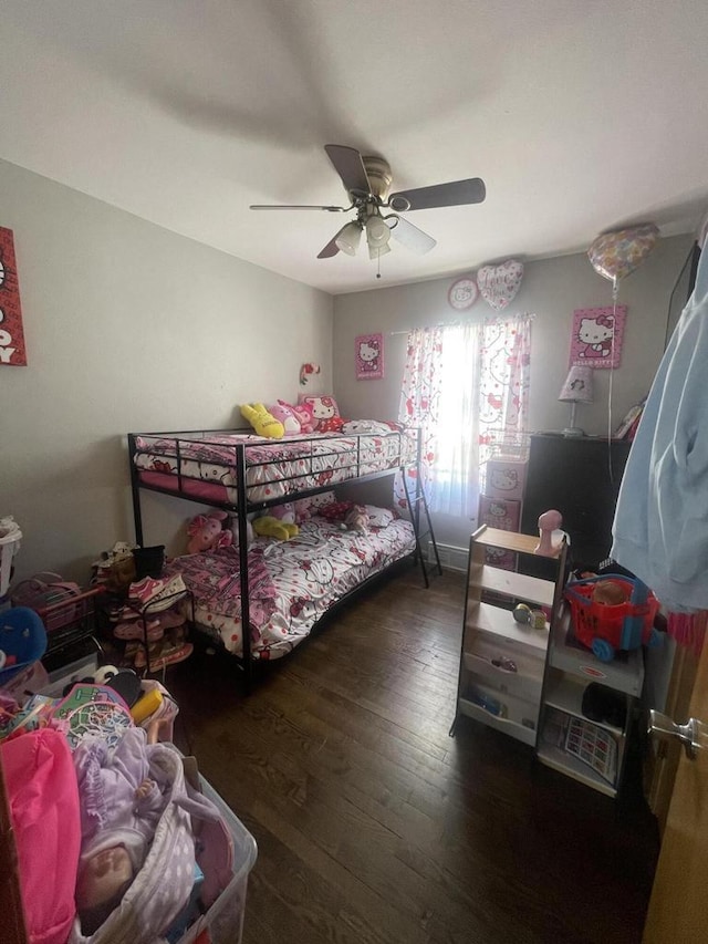 bedroom featuring ceiling fan and dark hardwood / wood-style floors