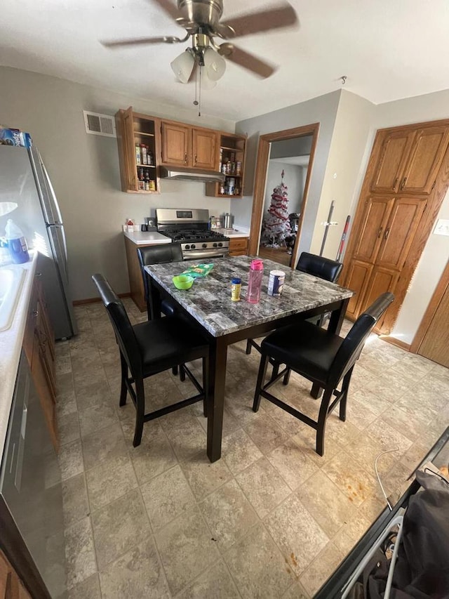 interior space with ceiling fan and sink