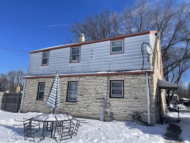 view of snow covered house