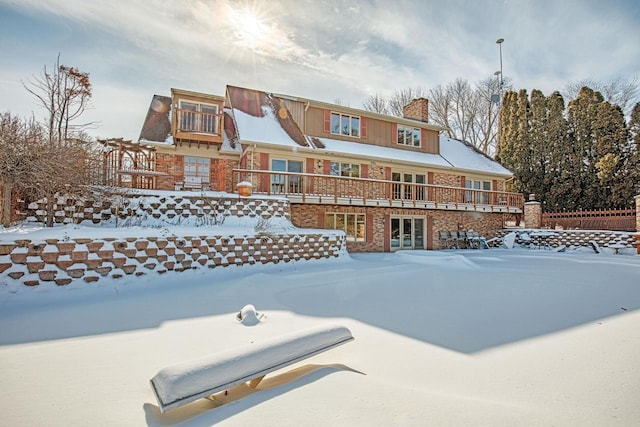 view of snow covered house