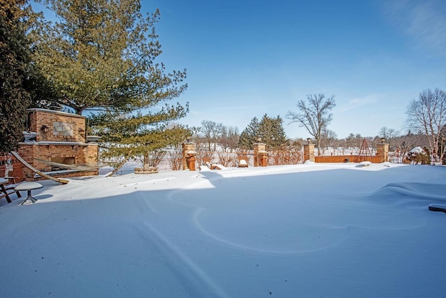 view of yard covered in snow