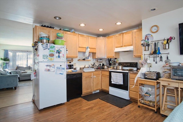 kitchen with white appliances, light brown cabinetry, and wood-type flooring