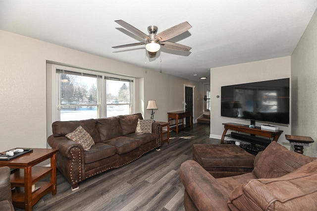 living room featuring dark hardwood / wood-style floors and ceiling fan