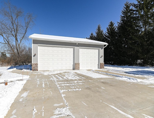 view of snow covered garage