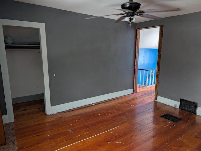 unfurnished bedroom with a closet and hardwood / wood-style floors