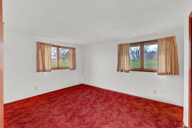 unfurnished room with carpet floors