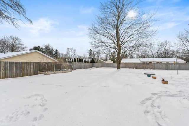 view of yard layered in snow