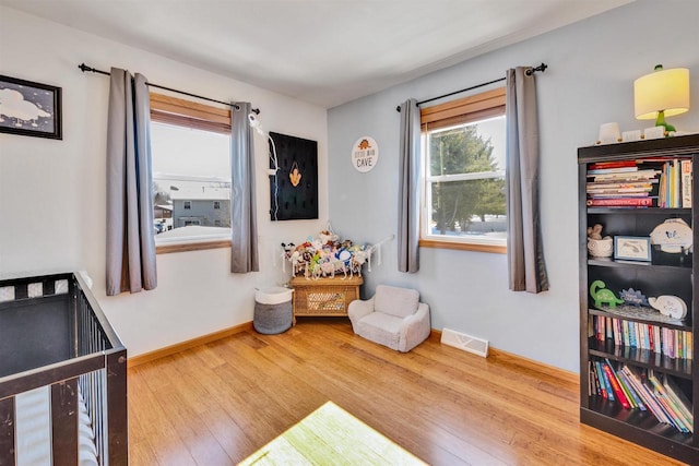 bedroom with light hardwood / wood-style floors