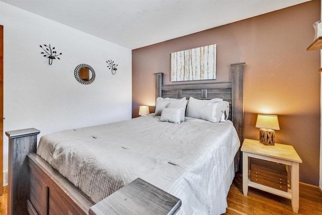 bedroom with hardwood / wood-style flooring