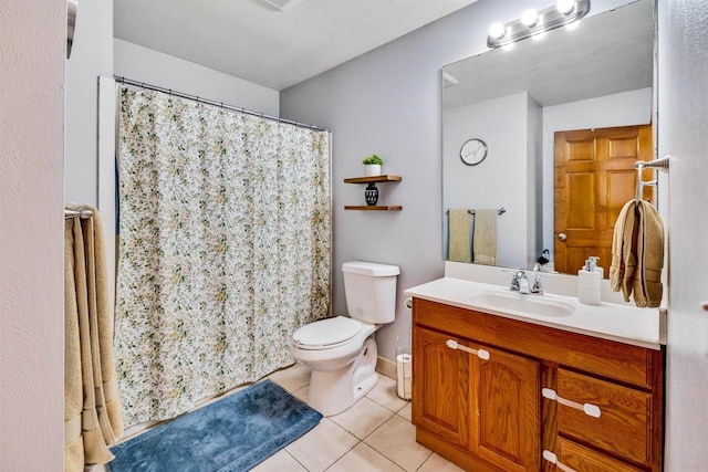 bathroom featuring tile patterned floors, toilet, and vanity