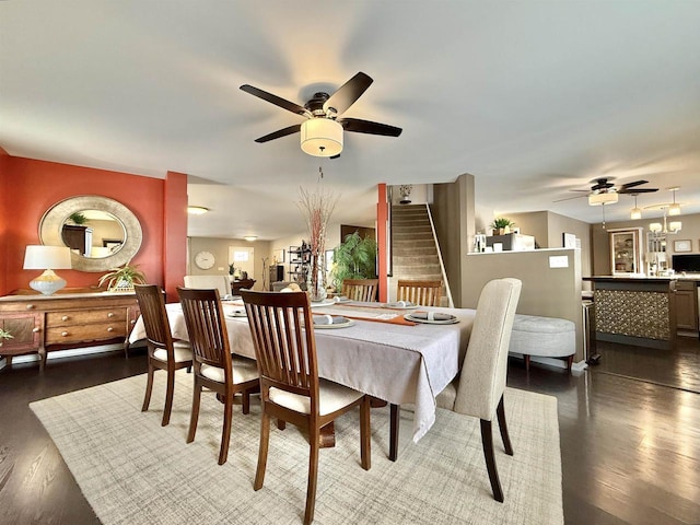 dining area with dark hardwood / wood-style floors and ceiling fan