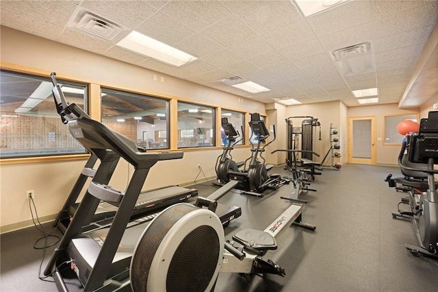 workout area with a paneled ceiling